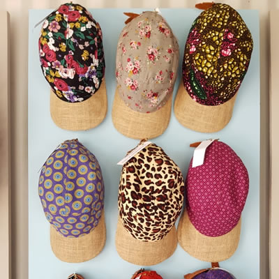 Jacqueline Kolbe - Hand-made adjustable peak caps using shweshwe and other colourful fabrics