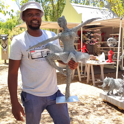 Jeff Mwazha with his crushed wire sculptures