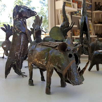 Sam Sithole with his stone birds, recycled metal animals and beadwork